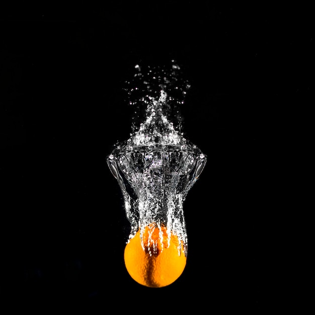 Free photo orange plunging into the water