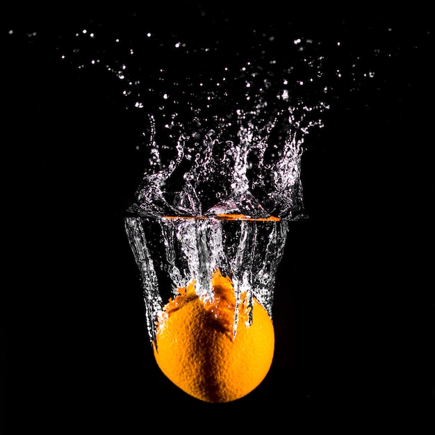 Orange plunging into the water