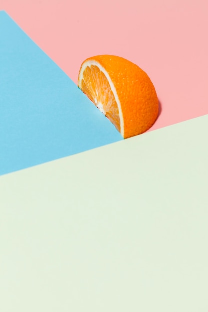 Free Photo orange slice on colorful background