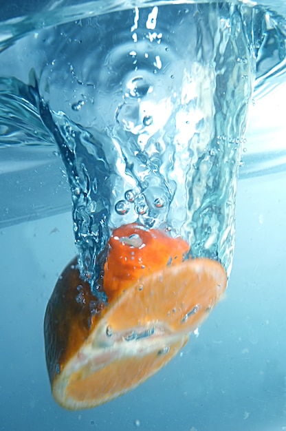 Free Photo orange submerged in water