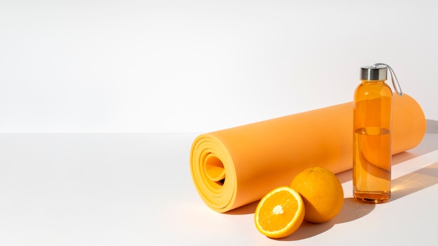 Free photo orange yoga essentials and orange high angle