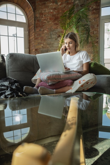 Free Photo order processing. caucasian woman, freelancer during the work in home office