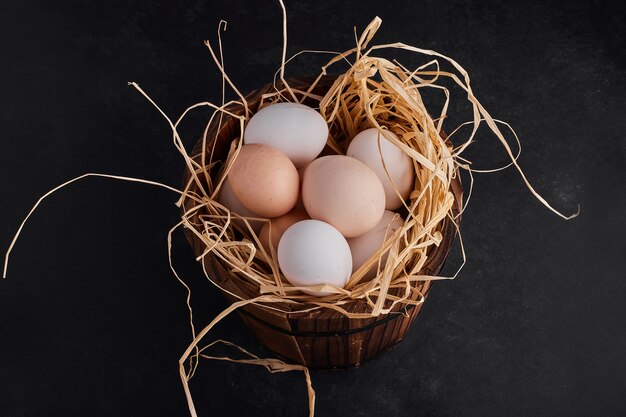 Organic eggs in the nest, top view. 