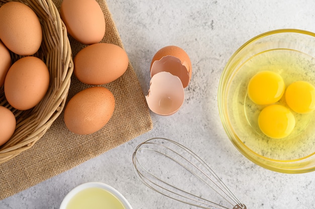 Organic eggs and oil preparing cooking meal