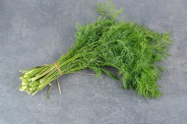 Organic fresh dill on marble backgroudn. High quality photo