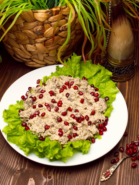 Oriental Arabic, Turkish food humus with pomegranate seeds.