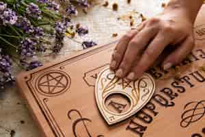 Free photo ouija board and flowers arrangement