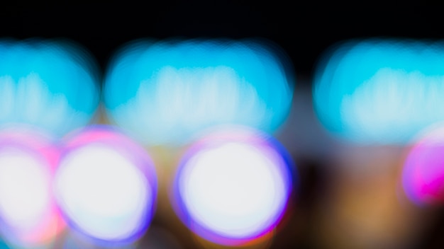 Free photo out-of-focus colorful bokeh neon lights