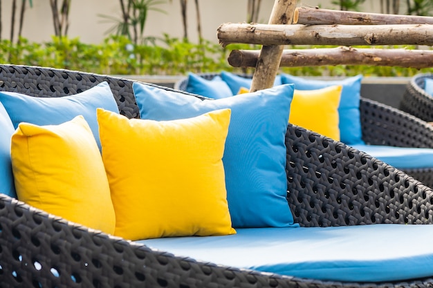 Free photo outdoor patio in the garden with chairs and pillows