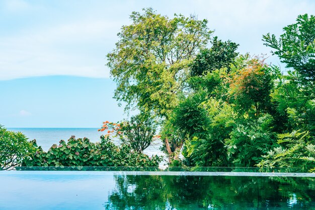 Outdoor swimming pool in hotel and resort neary sea and beach