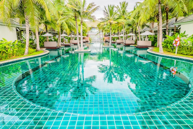 Outdoor Swimming pool in hotel resort for summer vacation