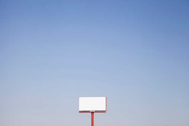 Free Photo an outdoor white hoarding against blue sky