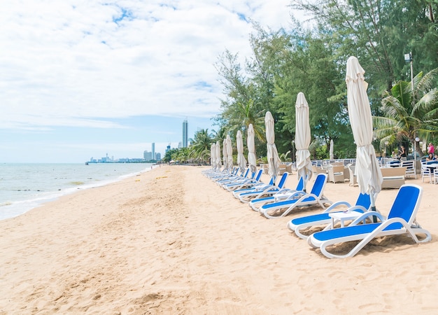 Outdoor with umbrella and chair on beautiful tropical beach and sea