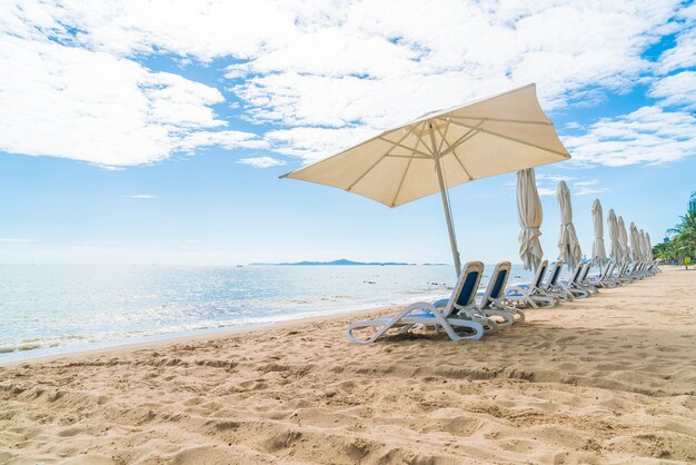 Outdoor with umbrella and chair on beautiful tropical beach and sea