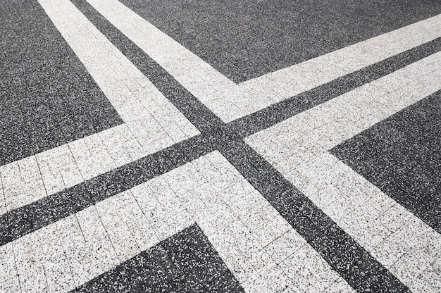 Free photo outdoors cobblestone texture with paint lines