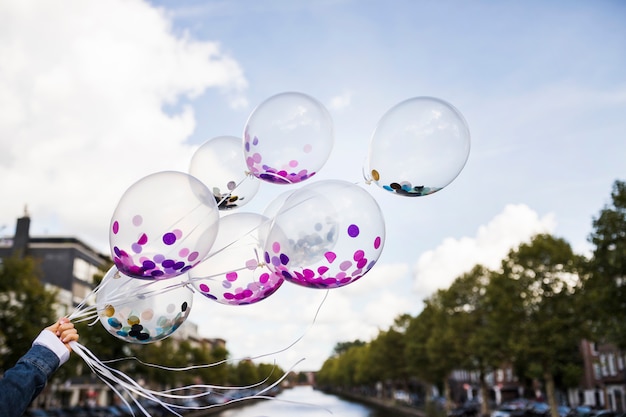 Free Photo outside transparent balloons with confetti inside