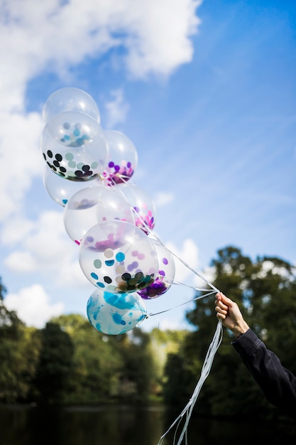 Free photo outside transparent balloons with confetti inside