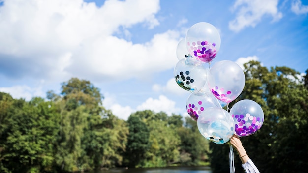 Free photo outside transparent balloons with confetti inside