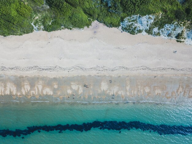 Overhead shot of a beach and a sea near Bowleaze Cove in Weymouth, UK