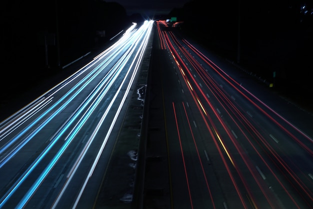 Free photo overhead shot of a highway road with car light speed trails