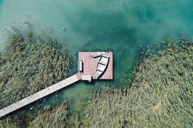 Free Photo overhead shot of a little dock at the coast with parked fishing boats