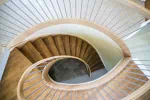 Free photo overhead shot of a modern house wooden spiral staircase