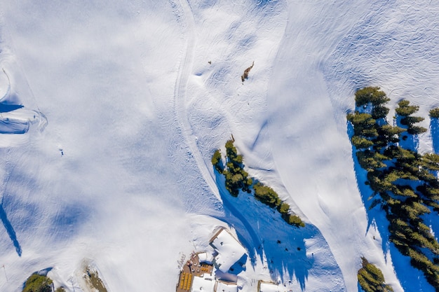 Overhead shot of the snow-covered cliffs captured on a sunny day