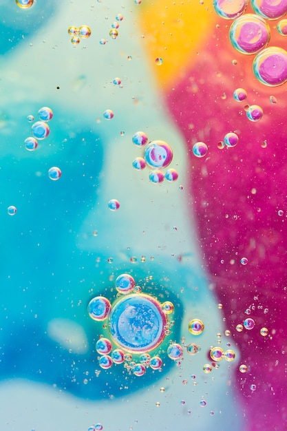 Free photo overhead view of bubbles on colorful background