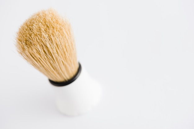 Free Photo an overhead view of classic shaving brush against white background