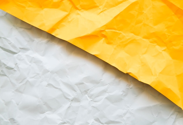 Free Photo overhead view of crumpled white and yellow papers