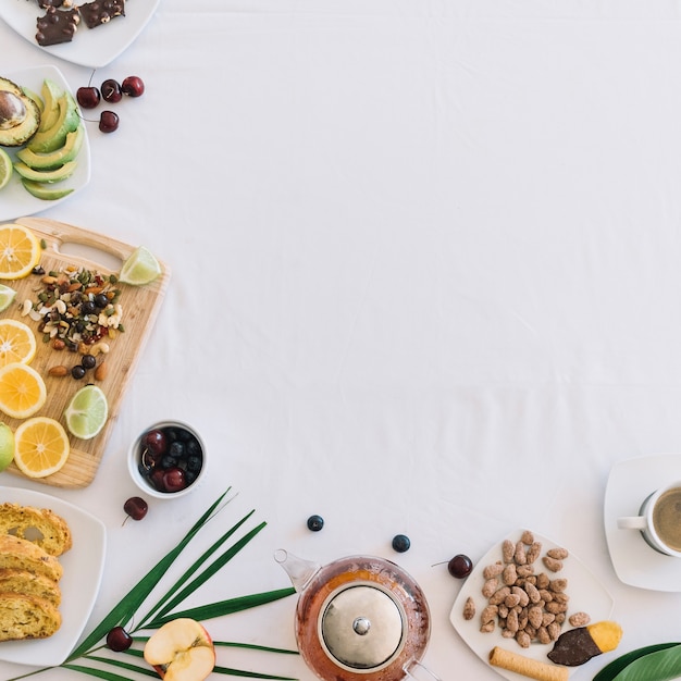 An overhead view of healthy breakfast on white background