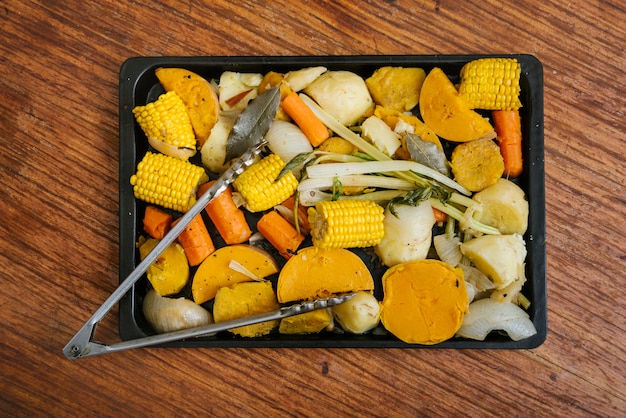 Free Photo overhead view of healthy food in tray on wooden desk