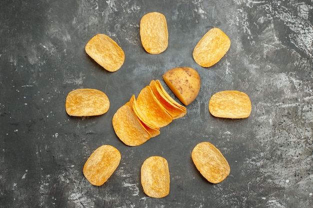 Free Photo overhead view of homemade delicious potato chips on gray table