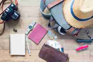 Free photo overhead view of man's accessories, traveler items on wooden background. travel concept