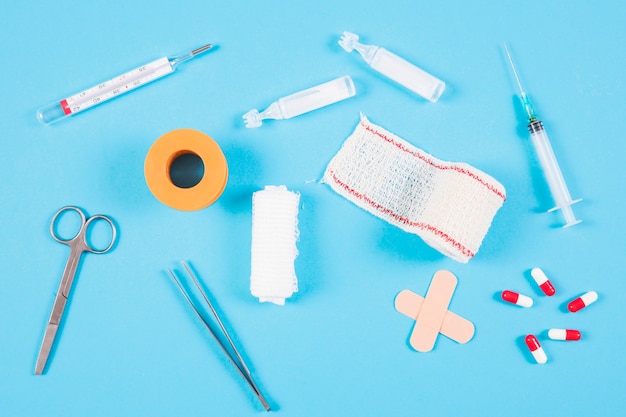 Free photo overhead view of medical equipments on blue backdrop