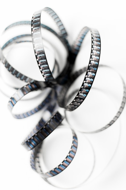 Free photo an overhead view of tangled film stripes isolated on white backdrop