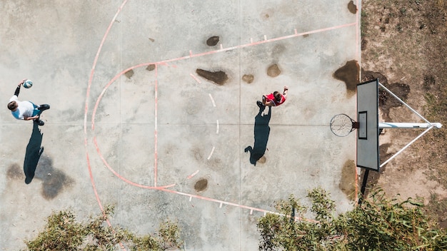 Free Photo overhead view of two players playing basketball