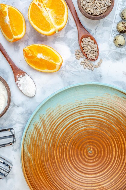 Overhead view of two-toned plate and ingredients for the healthy food set on ice background