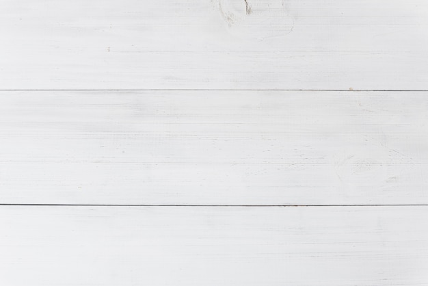 An overhead view of wooden white plank background