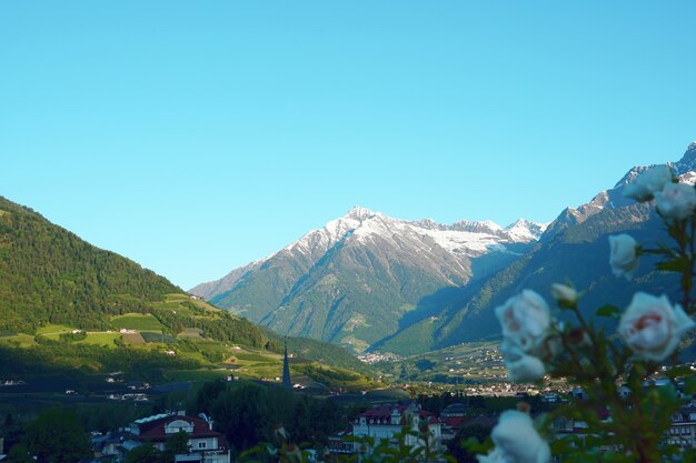 Overlooking view of buildings surrounded by steep mountains