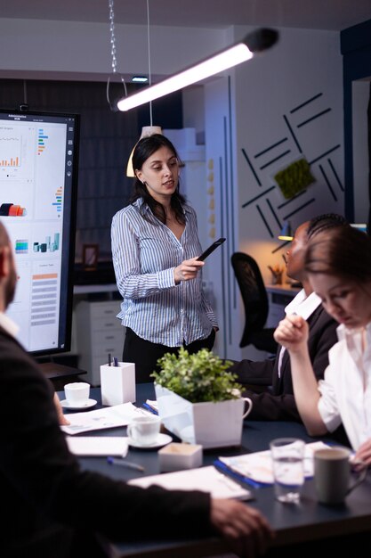 Overworked focused diverse businesspeople working in business company meeting office room