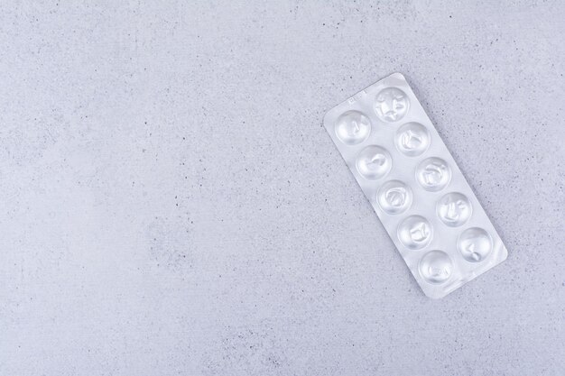 A pack of medical pills on marble background. High quality photo