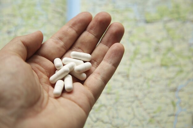 A pack of medical pills on a world map