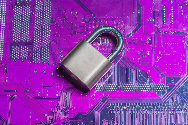 Free photo padlock on a computer circuit board