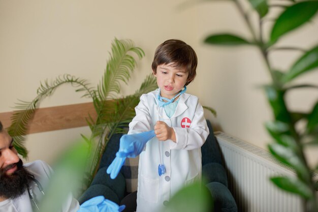 Paediatrician doctor examining a child in comfortabe medical office