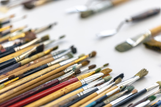 Free Photo paint brushes stained with paint closeup macro shot