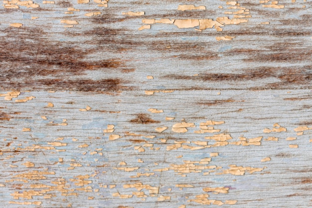 Free photo paint chipping on aged wooden surface