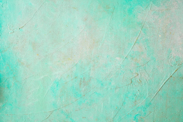 Free photo painted concrete weathered turquoise wall