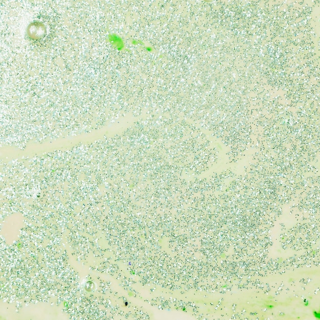 Free Photo painted green water with bright sequins