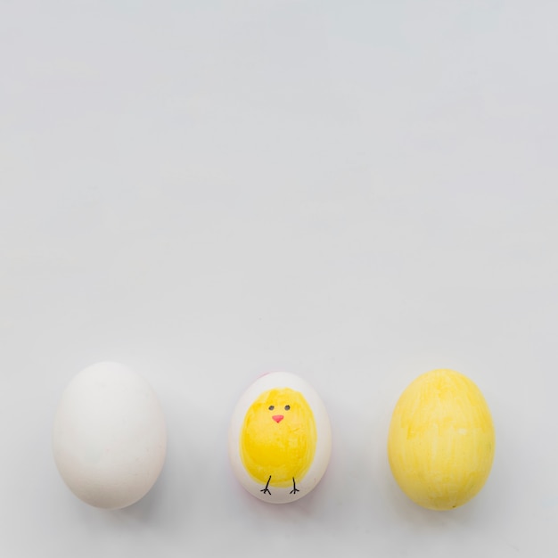 Painted three eggs on white background